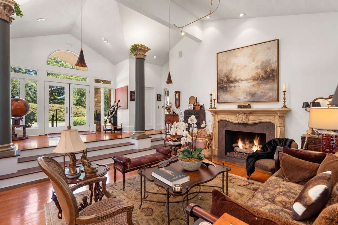 Living room, columns and the French limestone mantel