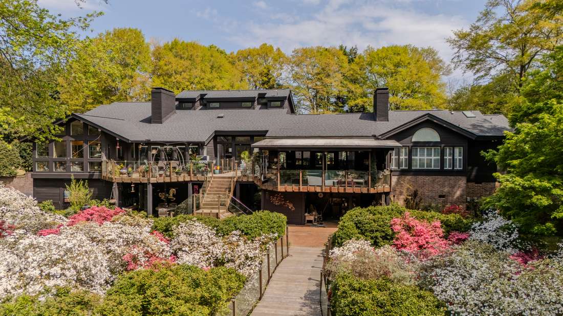 Rear elevation, azaleas and the bridge